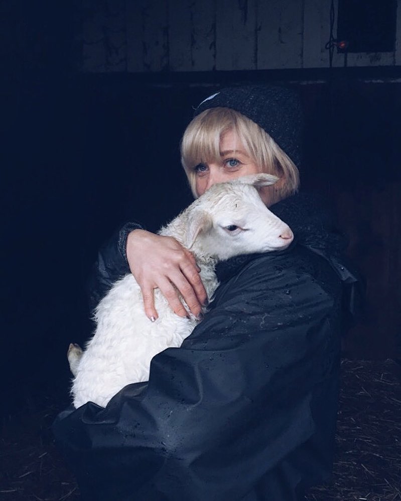 Image of author holding a small goat.